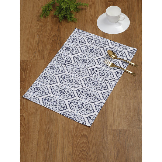 Four premium-quality cotton placemats in a delightful blue and white color palette with a geometric print.