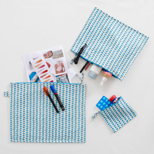 Set of 3 vibrant animal print pouches in blue, and white, perfect for storing makeup, travel essentials, or small treasures.