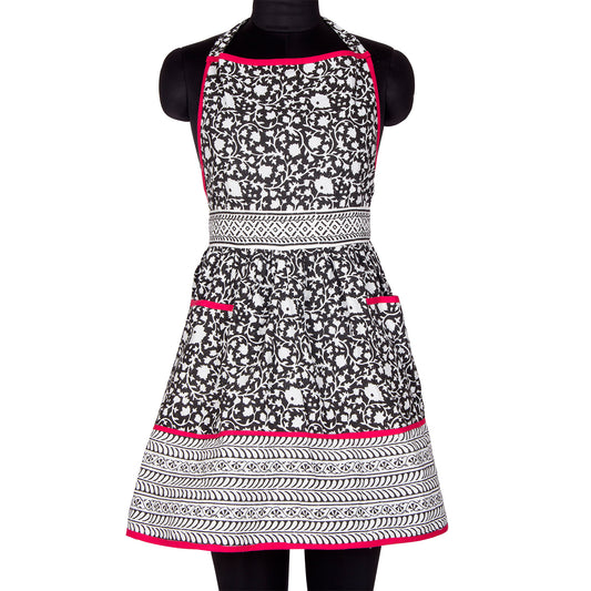 A stylish black and white chef's apron with a pop of pink, perfect for the home cook or professional chef.