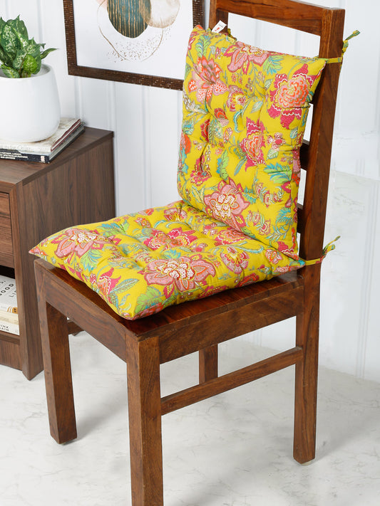 Soft tufted chair pad with a charming floral design in pink, green, and yellow, adding a touch of whimsy to any chair.