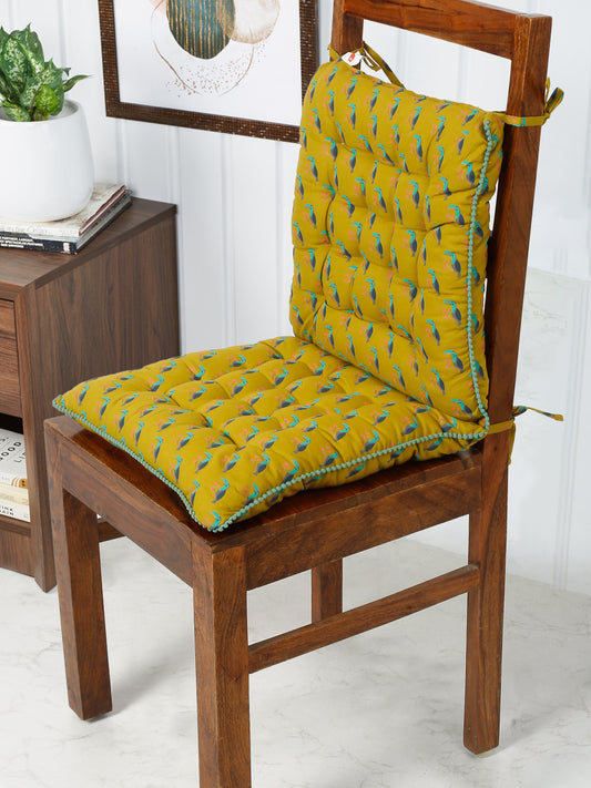 Sunny lemon yellow chair pad with a plush tufted diamond pattern and playful scalloped edges, adding a touch of summer joy to any chair.