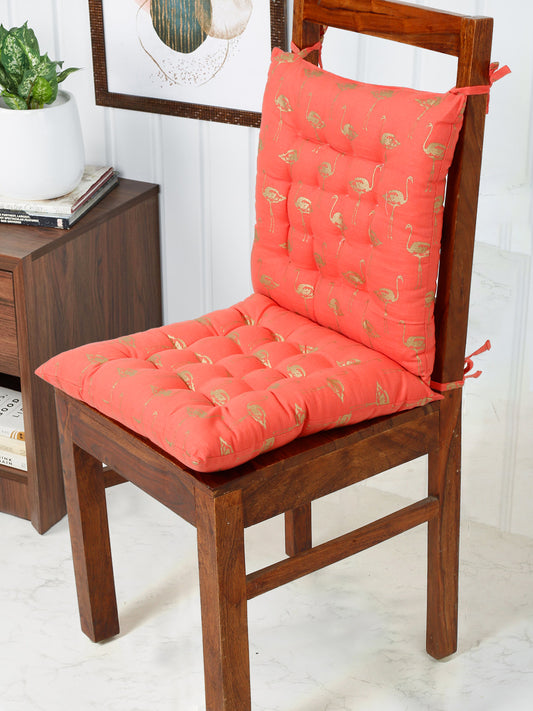 Eye-catching chair pad featuring a bold southwestern bird pattern in shades of orange, and gold, adding a touch of rustic charm to any chair.